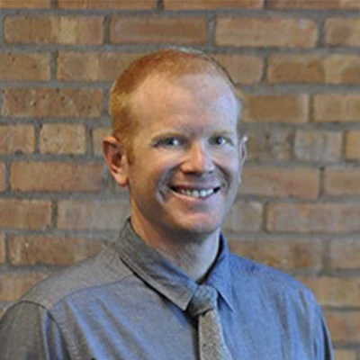 A headshot of Dr. Jason Fennema, a chiropractor at Ravenswood Health and Wellness Center.