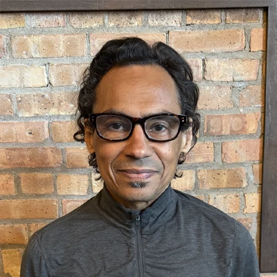 A headshot of Julio, a Massage Therapist at Ravenswood Health and Wellness Center.